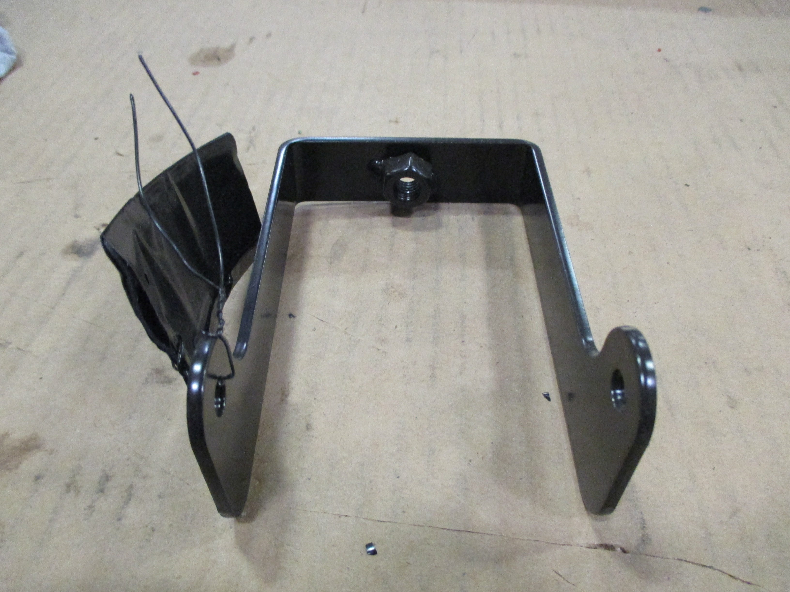 BRACKET, LEFT LOADER ARM LIGHT